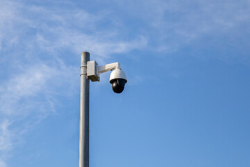 CCTV captures the announcement against a clear sky background.