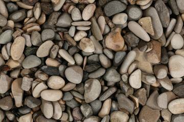 Nature wet sea pebbles background texture. natural aquarium soil. beach pebbles close up