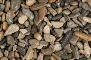 Nature wet sea pebbles background texture. natural aquarium soil. beach pebbles close up