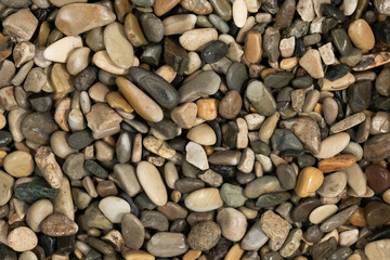 Nature wet sea pebbles background texture. natural aquarium soil. beach pebbles close up