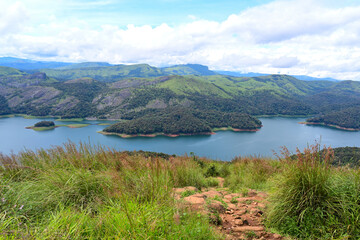 Island with red soiled bank seen in the middle of the frame