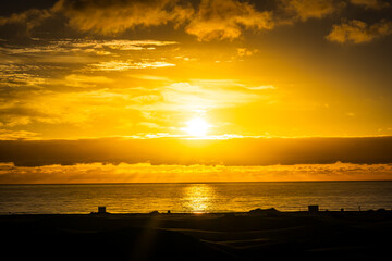 Sunrise over the Atlantic Ocean. Shot from the Dunes of Maspalomas Gran Canaria