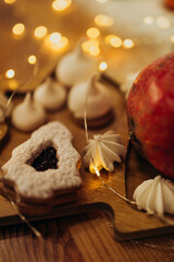 Fototapeta premium Christmas sweets and bakery close up with garlands