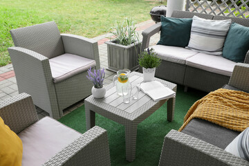 Beautiful terrace with comfortable furniture in yard