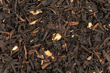 Pile leaf tea with various additives background, top view. Heap of dried tea texture