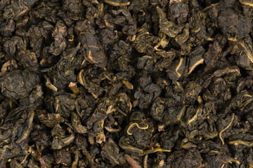 Pile leaf tea with various additives background, top view. Heap of dried tea texture