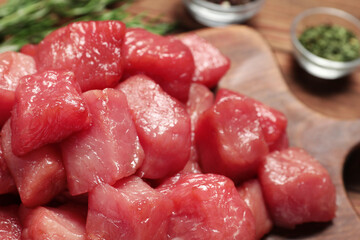 Cooking delicious goulash. Raw beef meat on wooden board, closeup