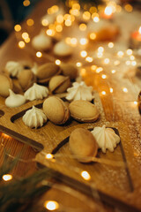 sweets and cookies on christmas table on wood stand