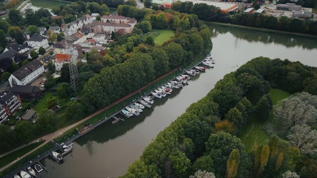 Drone aerial view of water canal with cargo ships, marina with boats at small town Datteln, Germany