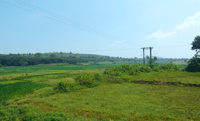 Transmission of electricity through rugged landscape of Purulia beaming with some hilltops and majestic valleys. Known as Jungle Mahal region in West Bengal.