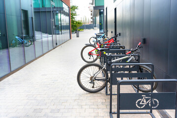 Sleek Bike Rack with Bicycles by a Modern Office Building