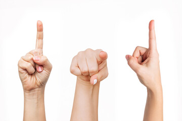 Set of young woman's hands showing gestures pointing up, forward and to the side at a copy empty...