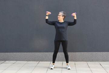 An athletic woman engaging in outdoor fitness, showcasing strength and wellness through various exercises in a city setting.