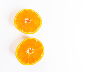 Sliced tangerine isolated on a white background. Top view, copy space.