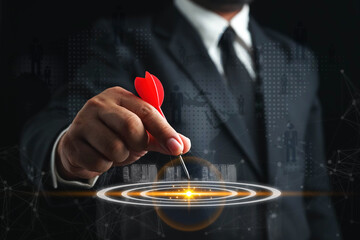 Success goals Targeting the business concept. Businessman throwing red arrow dart to virtual target...