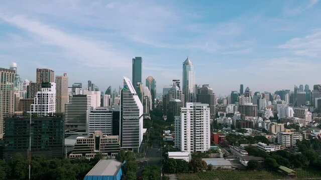 Aerial view city office building with green public park Sathorn dustrict central financial city of Bangkok Thailand