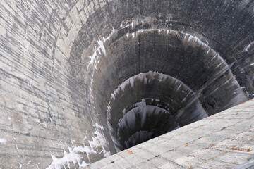 Semicircular spillway of Moiry Dam at the head of the Grimentz Valley, Switzerland. Flood control.