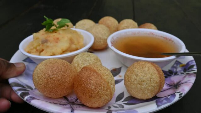 Delicious Panipuri. Its other names Golgappa and Puchka. It is a famous South Indian snacks. Traditional snacks of India. Pani puri.

