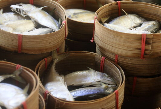 steamed horse mackerel fish in bamboo tray sold in thailand local market, steamed mackerel fish in bamboo tray