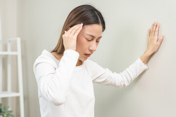 Dizzy asian young woman, girl headache or migraine pain. suffering from vertigo, difficulty...