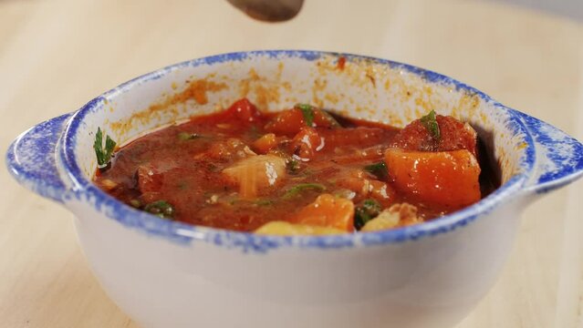 Hungarian Goulash soup with potato, carrot, meat and bolgarian papper and parsley cilantro in top. Shurpa soup
