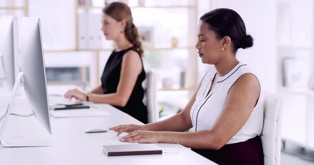 Computer, typing and business women in the office doing legal research on the internet for a case. Technology, desktop and professional female attorneys working on a law project in modern workplace.