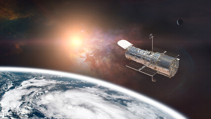 Space telescope, above the Earth planet, with the sun light. Elements of this image furnished by NASA.