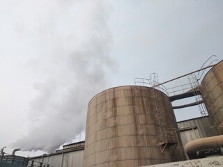 low angle view of huge storage tank for high temperature liquid