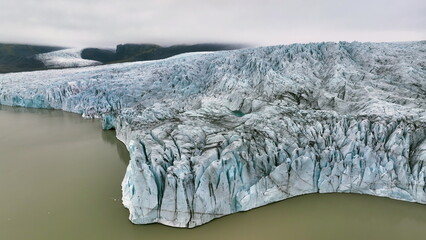 Aerial view of white glacier. Epic Drone Shot iceberg - 682429988