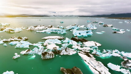 Aerial view of icebergs floating in Jokulsarlon lagoon, Climate change. Iceland - 682430163