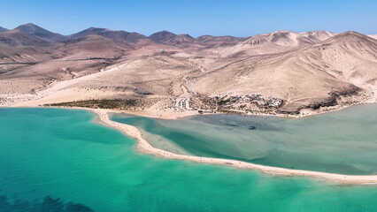 Fototapeta na wymiar Aerial view of golden sand and crystal sea water on the Canary