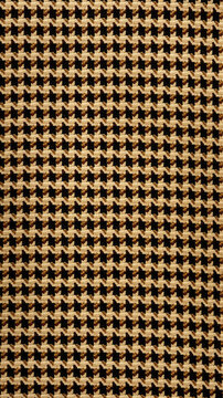 A brown and tan houndstooth pattern with an oval shape in the middle