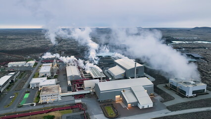 4K aerial video of geothermal energy plant, pipes and smoke chimneys. Iceland - 682434715
