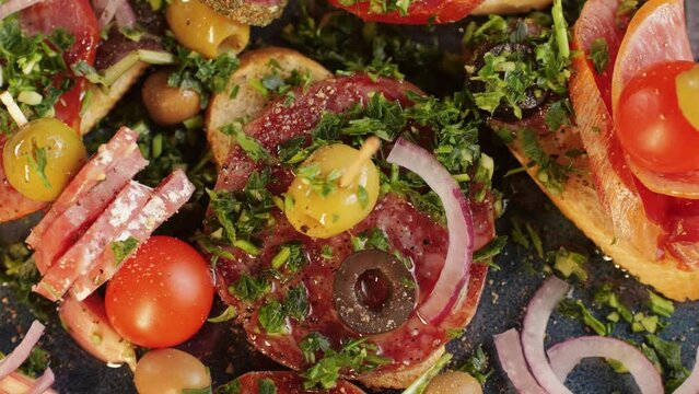 Tapas, Mix of spanish pork sausages, Cutting board of appetizing catalonian snack - fuet, jamon, chorizo, olives, supermarket tapas food in spain, traditional cuisine. 