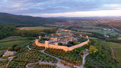 Aerial view of Tuscan landscape with ancient walled city Monteriggioni, Italy. Tuscany medieval town on the hill. - 682438313