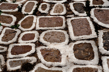 greek islands pebble street floor, whitewashed stones, texture background