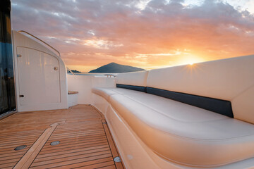 Luxury traveling. Interior of modern motor yacht on sunset