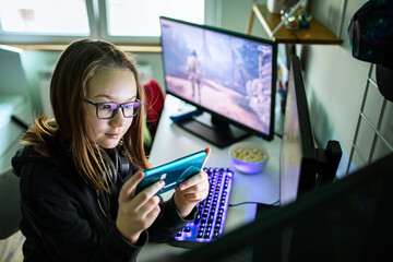 Young Gamer Intensely Playing on a Handheld Console