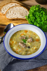 Polish barley soup with vegetables and chicken heart.