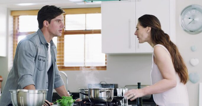 Cooking, divorce and a couple in the kitchen of their home, arguing about food, ingredients or the recipe. Stress, fighting or breakup with a man and woman in conflict or disagreement over a meal