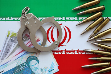 Iran flag and police handcuffs with iranian money bills rials. The concept of crime and offenses in...
