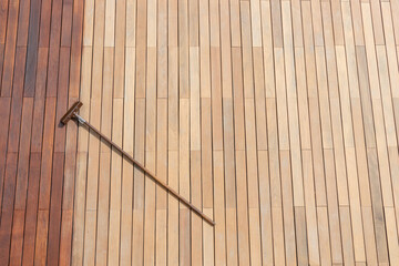 Freshly painted terrace hardwood floor, deck stain brush