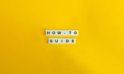 How-to, Guide, Guidance, Advice, Direction Concept image. 
Letter Tiles on Yellow Background. Minimal Aesthetic.