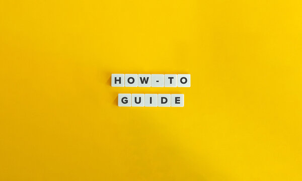 How-to, Guide, Guidance, Advice, Direction Concept image. 
Letter Tiles on Yellow Background. Minimal Aesthetic.