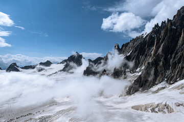 Fototapeta na wymiar Panoramic view over mountain ridges leading to the Mont Blanc
