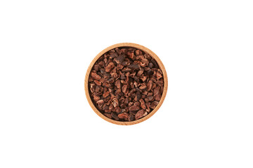 Cocoa nibs in wooden bowl on white background, top view. Sugar-free product, Natural antidepressant. Crushed cocoa beans of weak roasting often added to cereals, smoothies, desserts, and drinks.