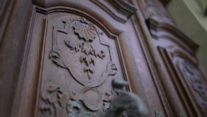 Beautiful ancient door filled with adornment, doorknob and ornamentation. Aesthetic antique...