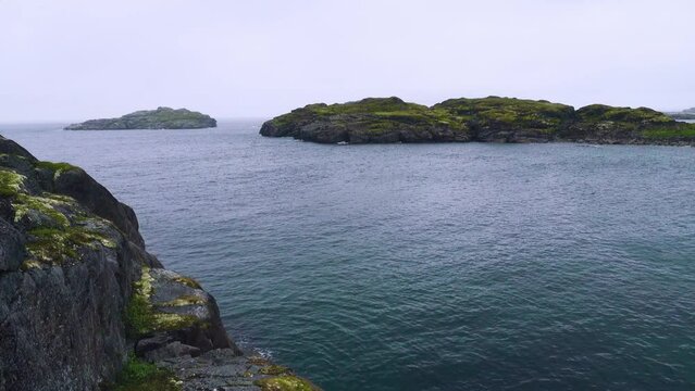 This is the Arctic. Skerries (skargard - rocky islets along a rugged coast) of north-eastern Scandinavia. The coast of the Barents Sea