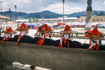 Tzotziles male in traditional clothing waiting for the ceremony of the chiapas famous village San Juan de Chamula , Mexico , October 2023  - obrazy, fototapety, plakaty