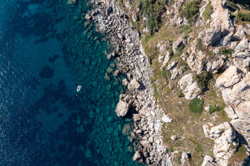 Porquerolles' rugged cliffs meet the clear Mediterranean.